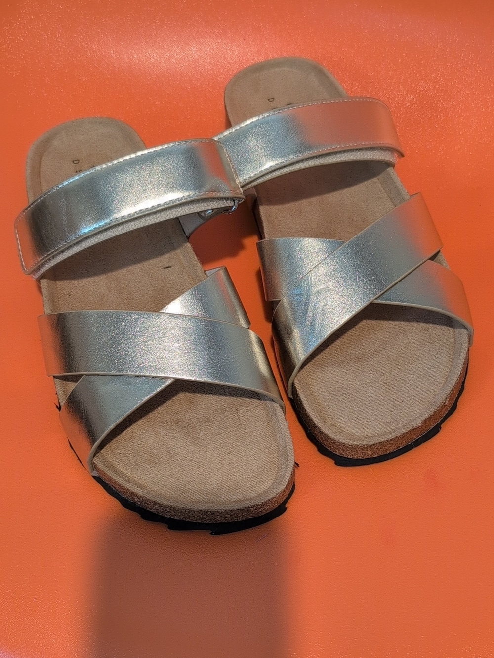 ASOS neutral beige sandals with orange backdrop